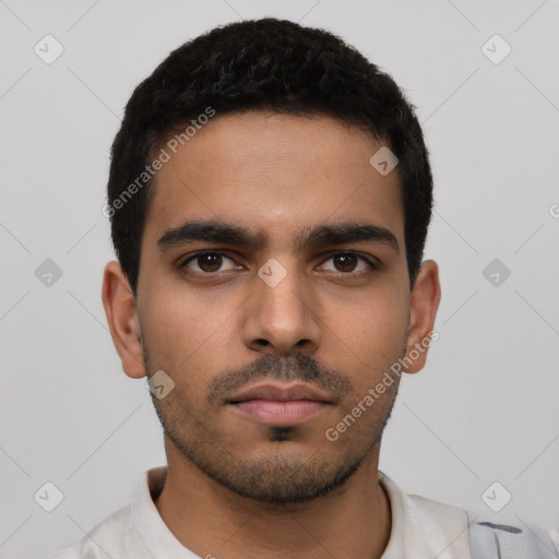 Neutral latino young-adult male with short  black hair and brown eyes