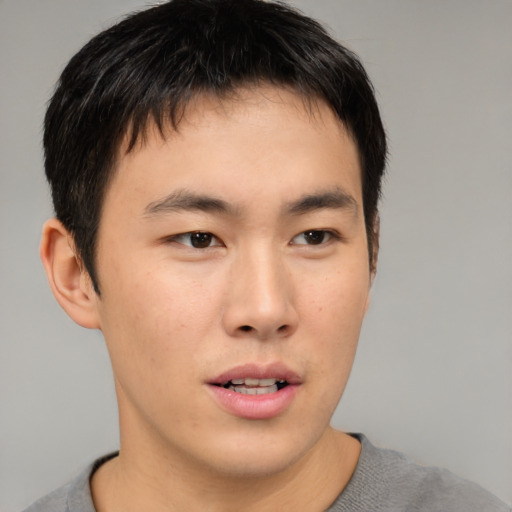 Neutral asian young-adult male with short  brown hair and brown eyes