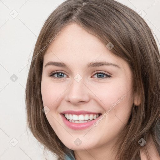 Joyful white young-adult female with medium  brown hair and green eyes