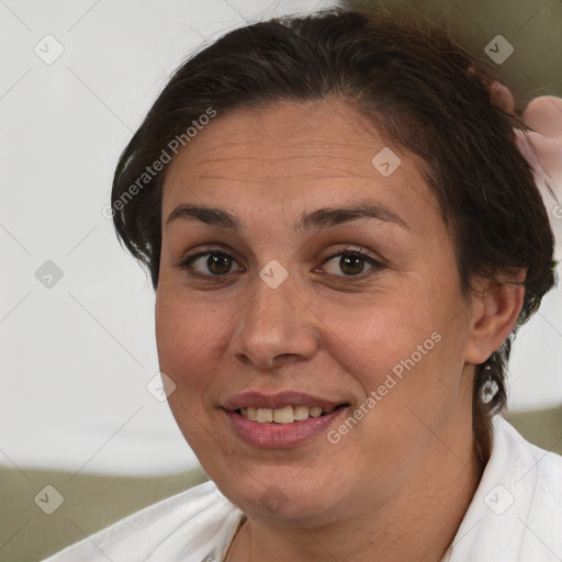 Joyful white adult female with short  brown hair and brown eyes