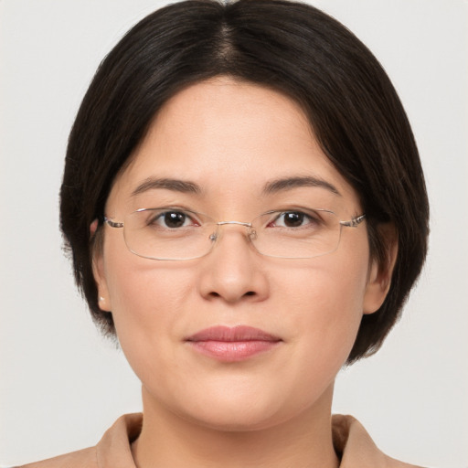 Joyful white adult female with medium  brown hair and brown eyes