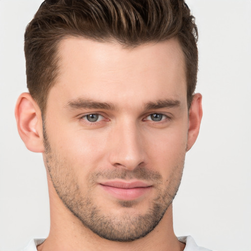 Joyful white young-adult male with short  brown hair and brown eyes