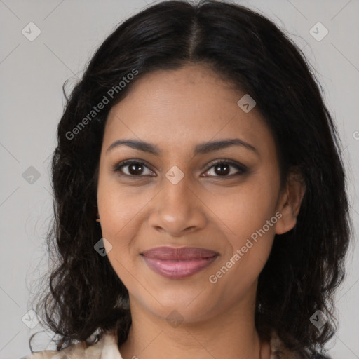 Joyful black young-adult female with long  brown hair and brown eyes