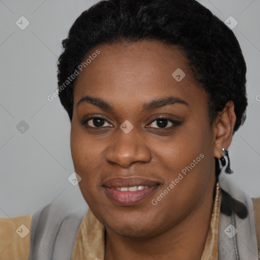 Joyful black young-adult female with long  brown hair and brown eyes