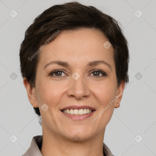 Joyful white adult female with short  brown hair and brown eyes