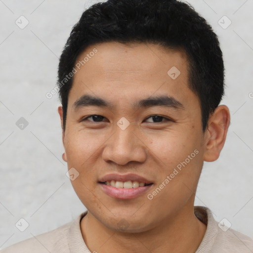 Joyful latino young-adult male with short  black hair and brown eyes