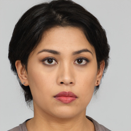 Neutral asian young-adult female with medium  black hair and brown eyes
