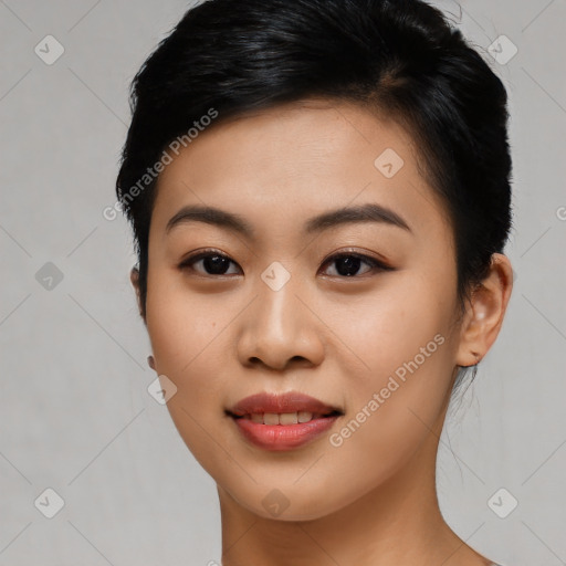 Joyful asian young-adult female with short  black hair and brown eyes