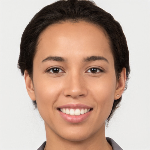 Joyful white young-adult female with medium  brown hair and brown eyes