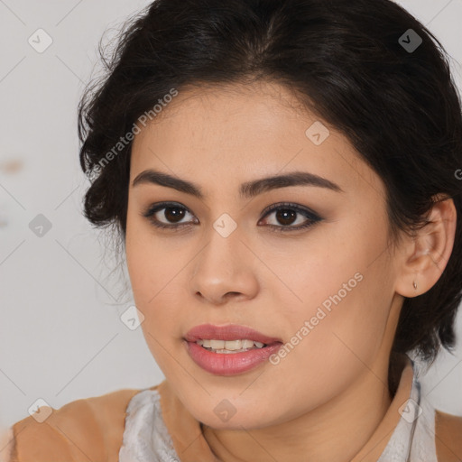 Joyful latino young-adult female with medium  brown hair and brown eyes