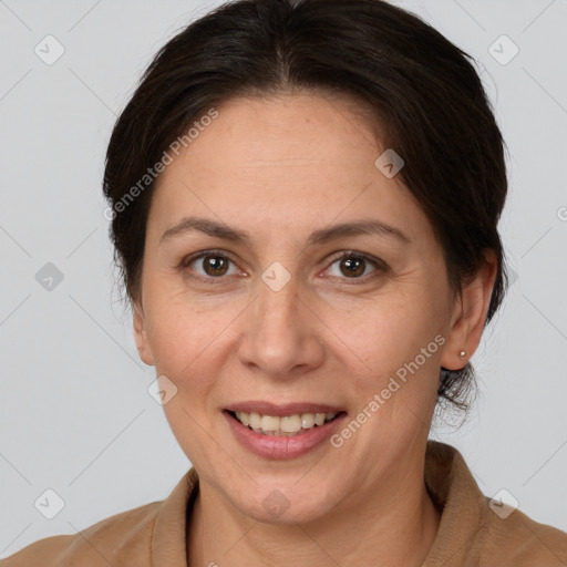 Joyful white adult female with medium  brown hair and brown eyes