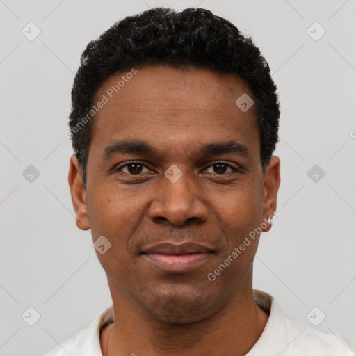 Joyful black young-adult male with short  black hair and brown eyes