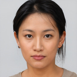 Neutral asian young-adult female with medium  brown hair and brown eyes