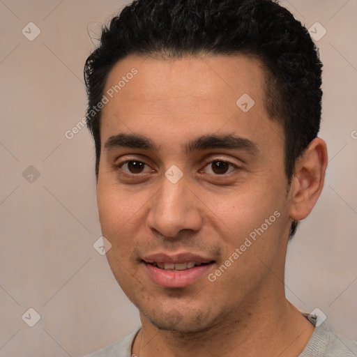 Joyful white young-adult male with short  black hair and brown eyes