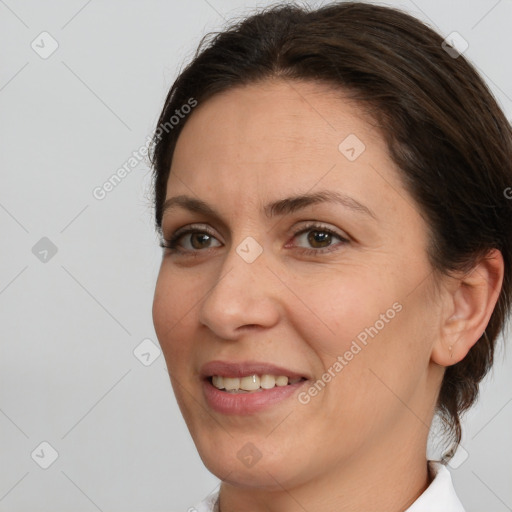 Joyful white adult female with medium  brown hair and brown eyes