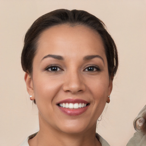 Joyful white young-adult female with medium  brown hair and brown eyes