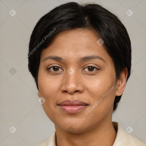 Joyful latino adult female with short  brown hair and brown eyes