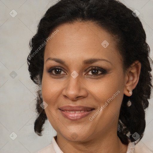 Joyful black adult female with medium  brown hair and brown eyes