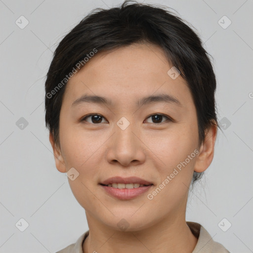 Joyful asian young-adult female with medium  brown hair and brown eyes