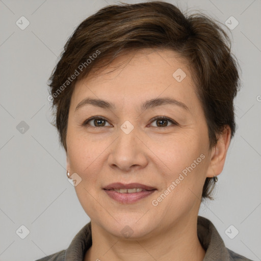 Joyful white adult female with short  brown hair and brown eyes