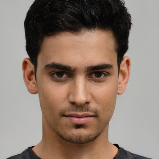 Neutral white young-adult male with short  black hair and brown eyes
