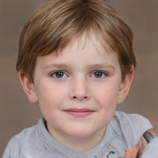 Joyful white child male with short  brown hair and grey eyes