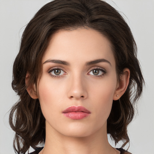 Neutral white young-adult female with medium  brown hair and brown eyes