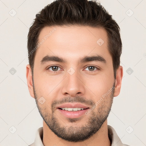 Joyful white young-adult male with short  brown hair and brown eyes