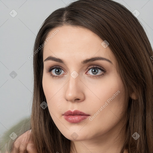 Neutral white young-adult female with long  brown hair and brown eyes