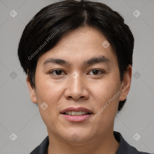 Joyful asian young-adult male with short  brown hair and brown eyes