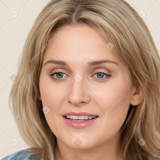 Joyful white young-adult female with medium  brown hair and blue eyes