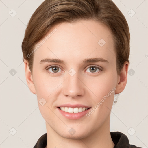 Joyful white young-adult female with short  brown hair and grey eyes