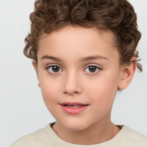 Joyful white child female with short  brown hair and brown eyes