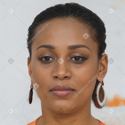 Joyful black young-adult female with short  brown hair and brown eyes