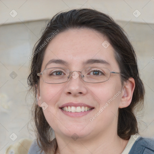 Joyful white adult female with medium  brown hair and blue eyes