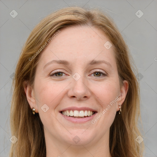 Joyful white adult female with medium  brown hair and blue eyes