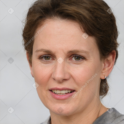 Joyful white adult female with short  brown hair and grey eyes