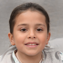 Joyful white child female with short  brown hair and brown eyes