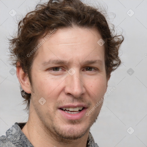 Joyful white adult male with short  brown hair and grey eyes