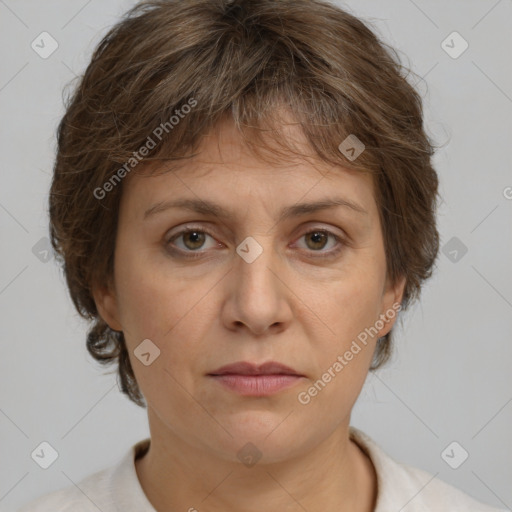 Joyful white adult female with short  brown hair and grey eyes