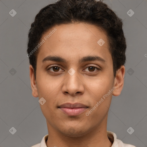 Joyful latino young-adult male with short  brown hair and brown eyes