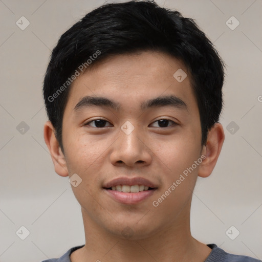 Joyful asian young-adult male with short  black hair and brown eyes