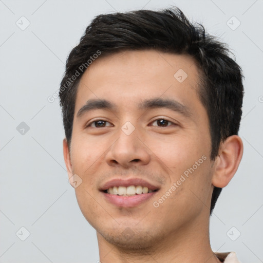 Joyful white young-adult male with short  black hair and brown eyes