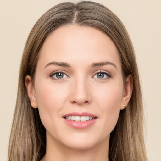 Joyful white young-adult female with long  brown hair and grey eyes