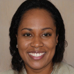 Joyful black young-adult female with medium  brown hair and brown eyes