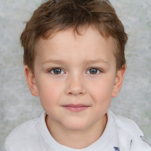 Joyful white child male with short  brown hair and brown eyes