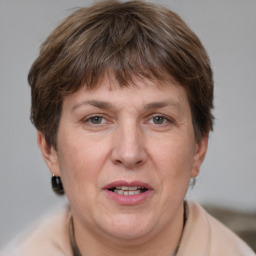 Joyful white adult female with short  brown hair and grey eyes