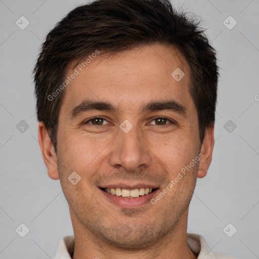 Joyful white young-adult male with short  brown hair and brown eyes