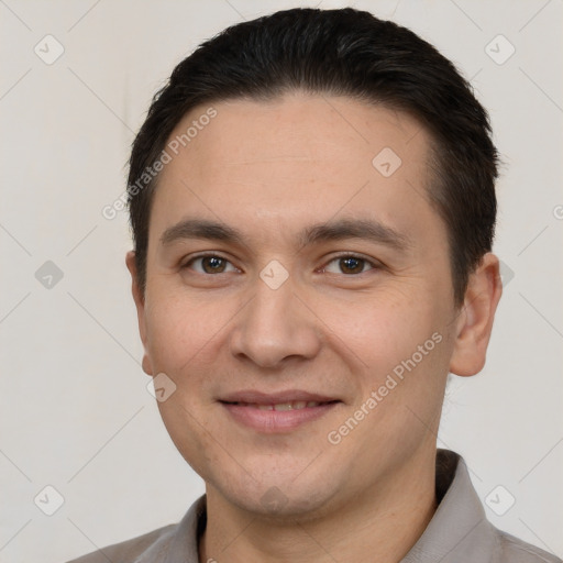 Joyful white young-adult male with short  brown hair and brown eyes