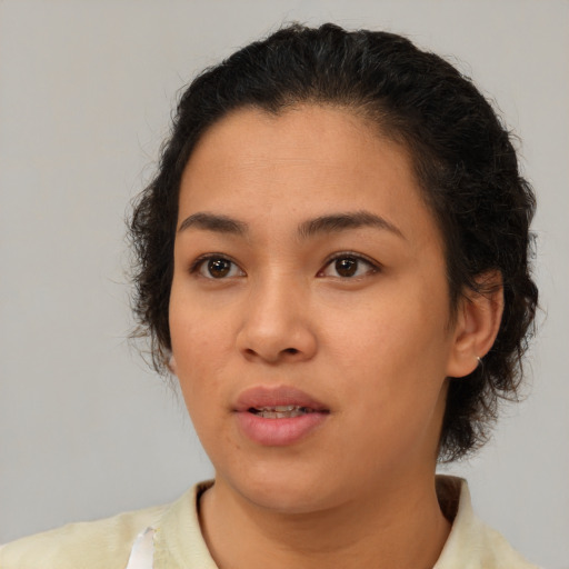 Neutral latino young-adult female with medium  brown hair and brown eyes